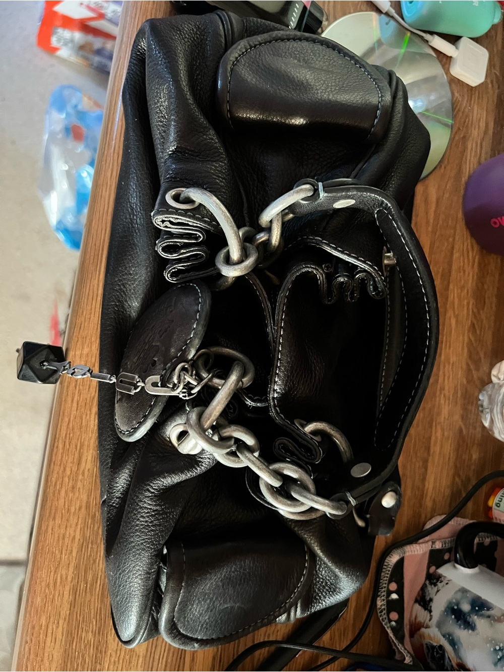 Juicy Couture Black Leather Shoulder Bag with Silver Chain Accents
